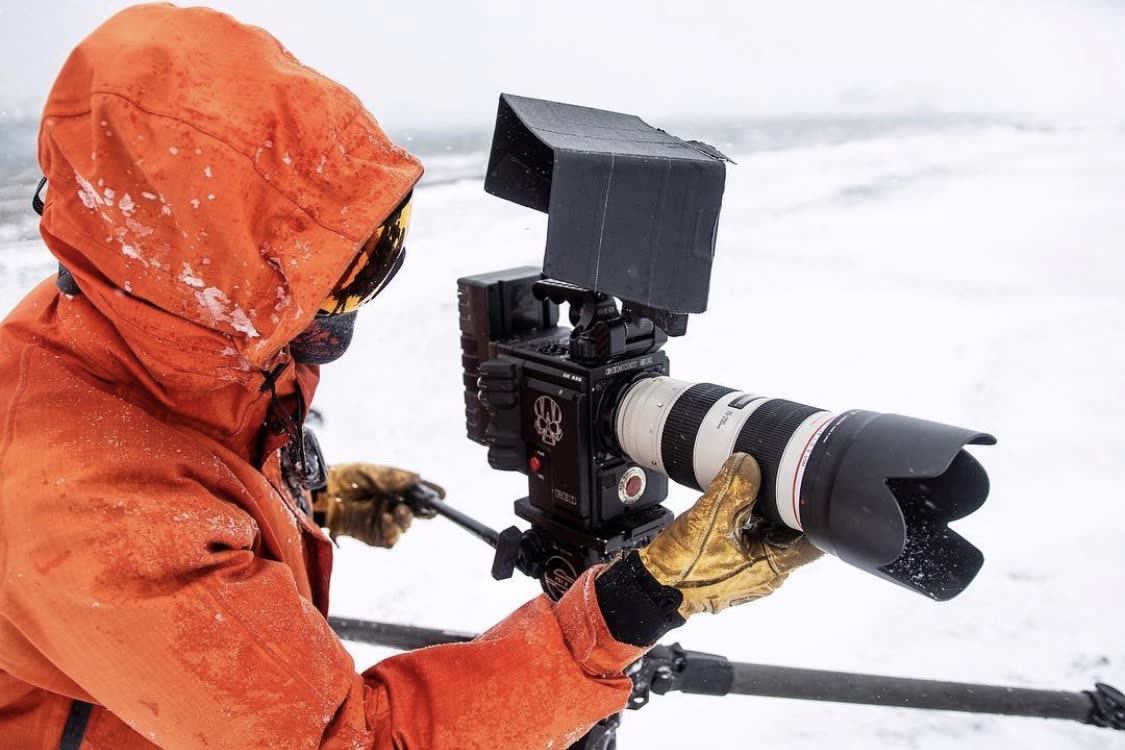 The Captain filming in the snow with a cinema camera